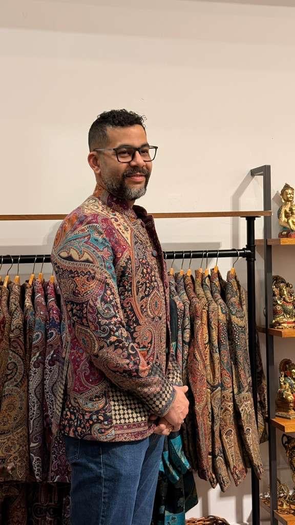 Man in patterned clothing store